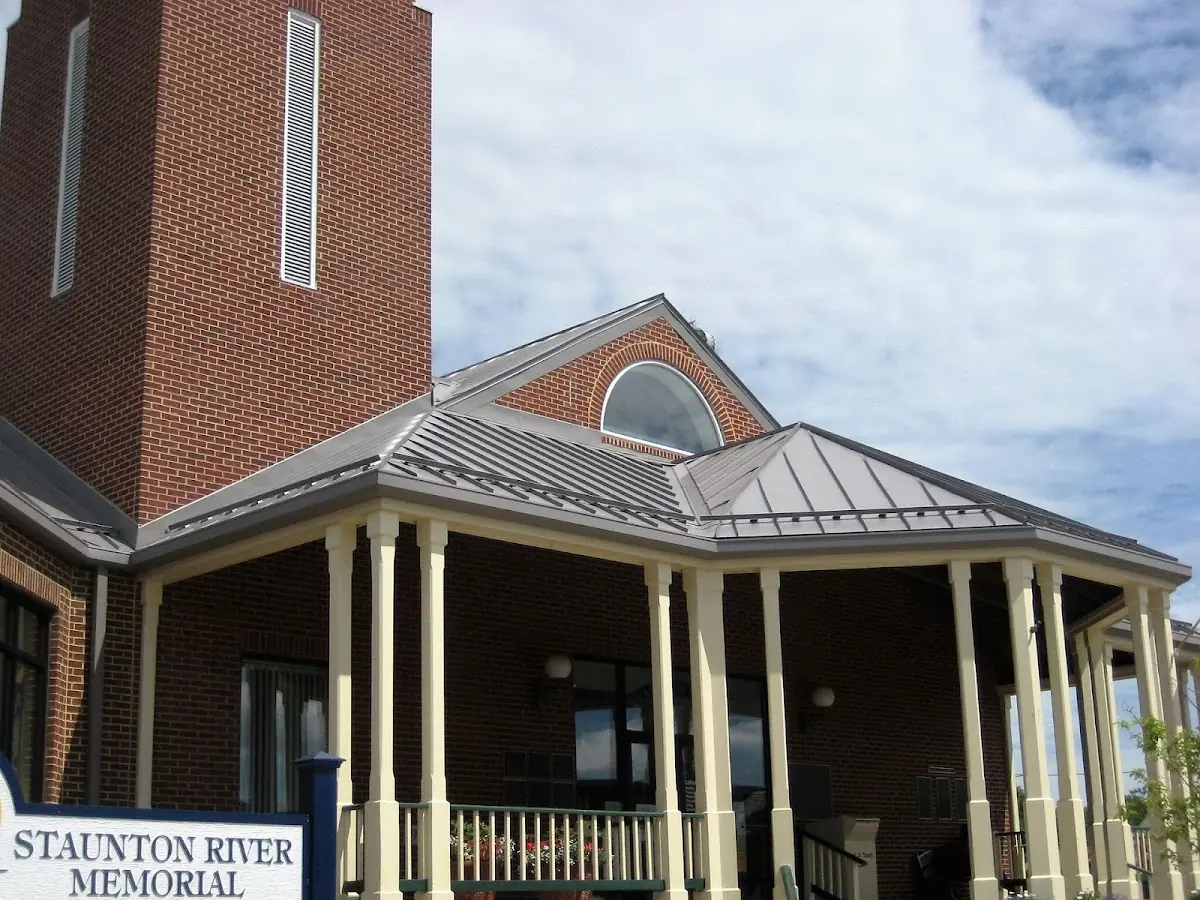 Skilled roofing craftsmen working on a residential roof in Harrisville